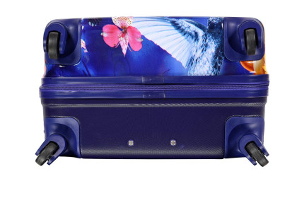 Valise rigide 4 roues femme colorée et fleurie Le Modiste avec oiseau des iles bleu foncée vue du dessous